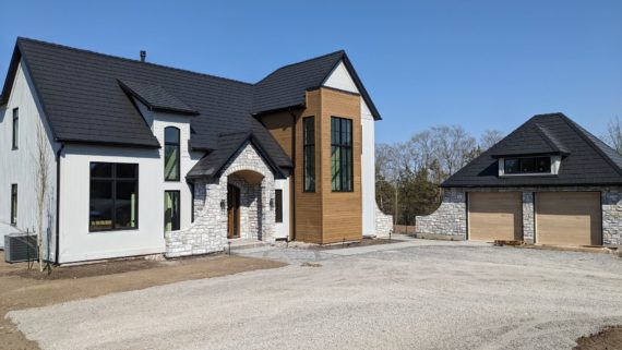 What a lovely house overlooking Adolphus Reach in Prince Edward County. Builder: Hickory Homes | Interior Design: Kleur Design | Landscaping: Wentworth Landscapes
